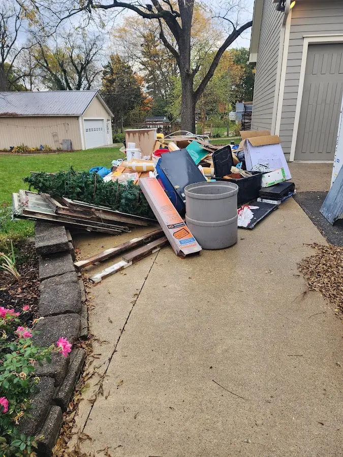 Dumpster being loaded with debris for 30 Yard Dumpster Rental in Bushland